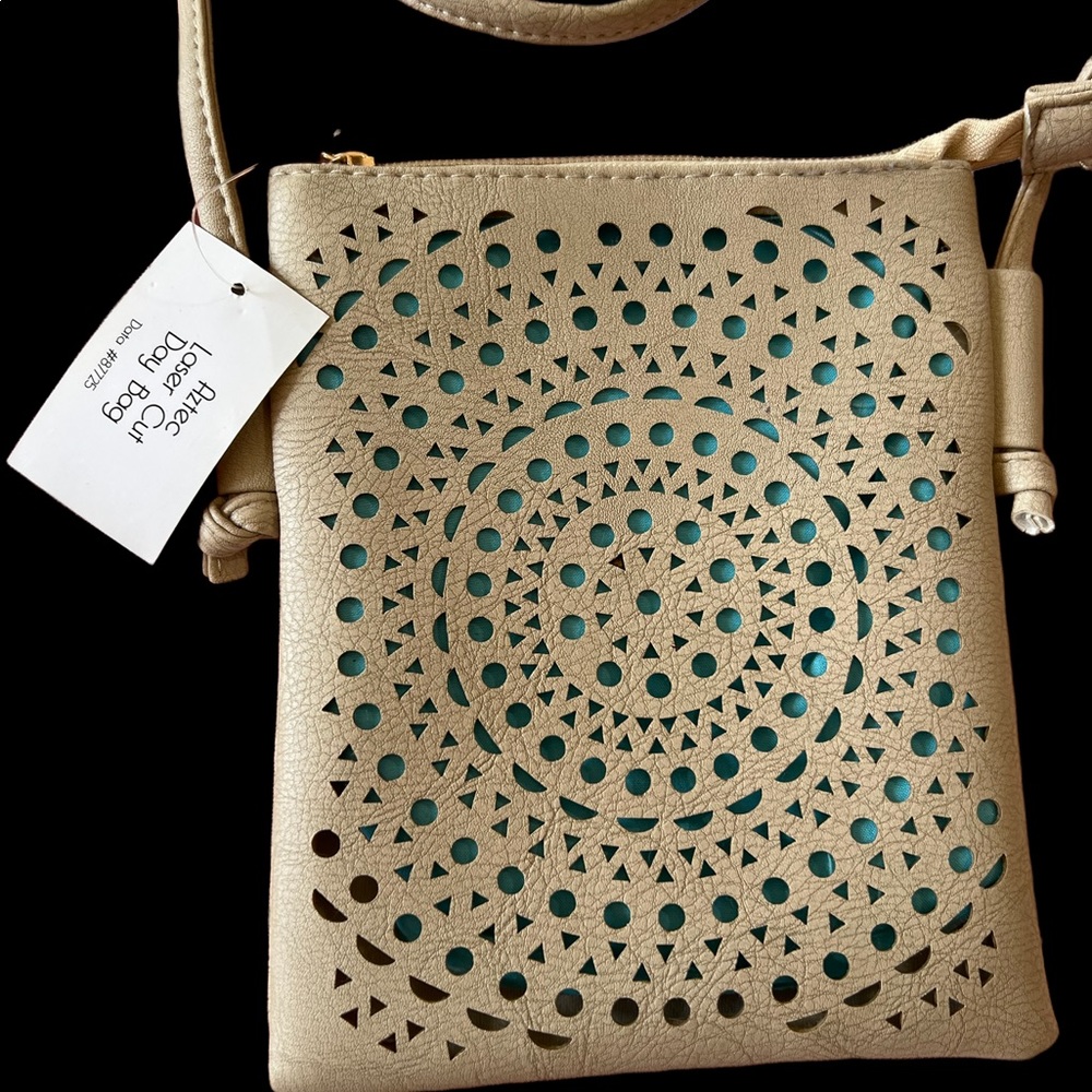 Small cross body purse. Laser cut design